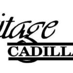 A black and white image of the logo for heritage cadillac.